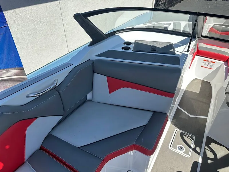 Slide: The Image of 2021 Supreme ZS212 boat interior with gray and red seating, modern design. - 17