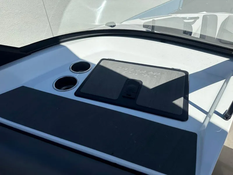 Slide: The Image of 2021 Supreme ZS212 boat dashboard with cup holders and storage compartment. - 18