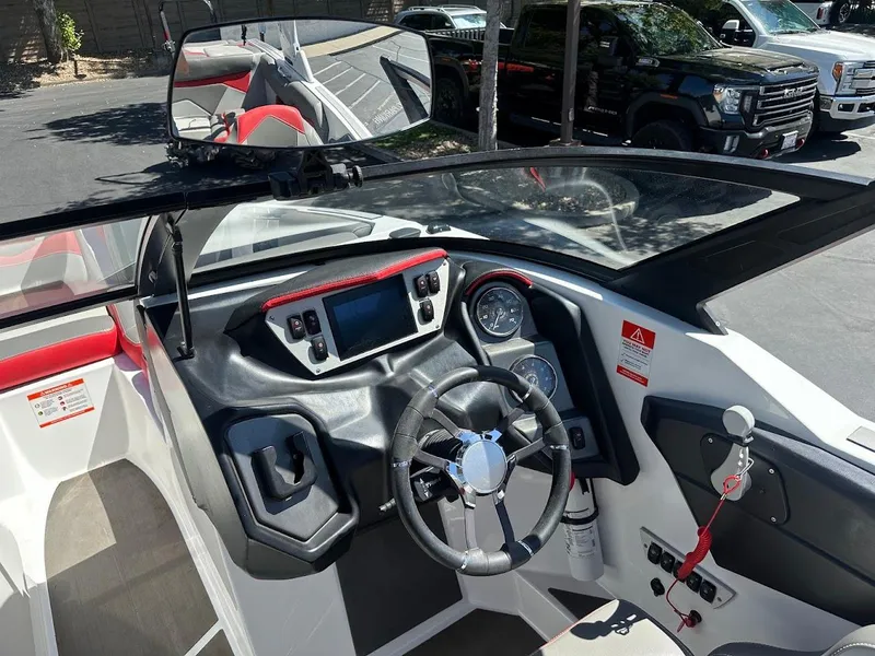 Slide: The Image of Interior of a 2021 Supreme ZS212 boat, featuring a modern dashboard and steering wheel. - 20