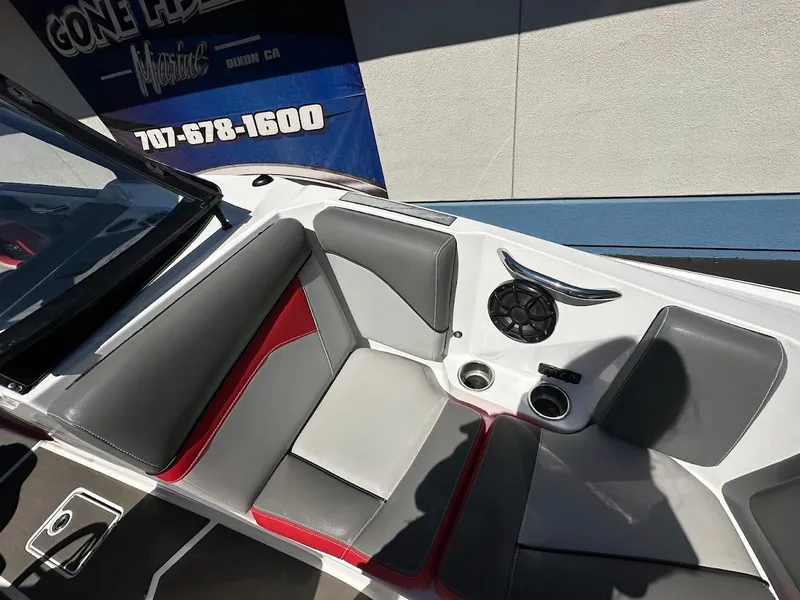 Slide: The Image of Interior of a 2021 Supreme ZS212 boat with gray and red seating. - 27
