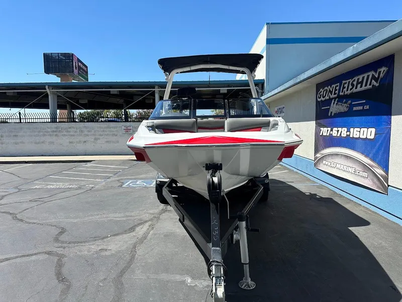 Slide: The Image of 2021 Supreme ZS212 boat on trailer at dealership parking lot. - 3