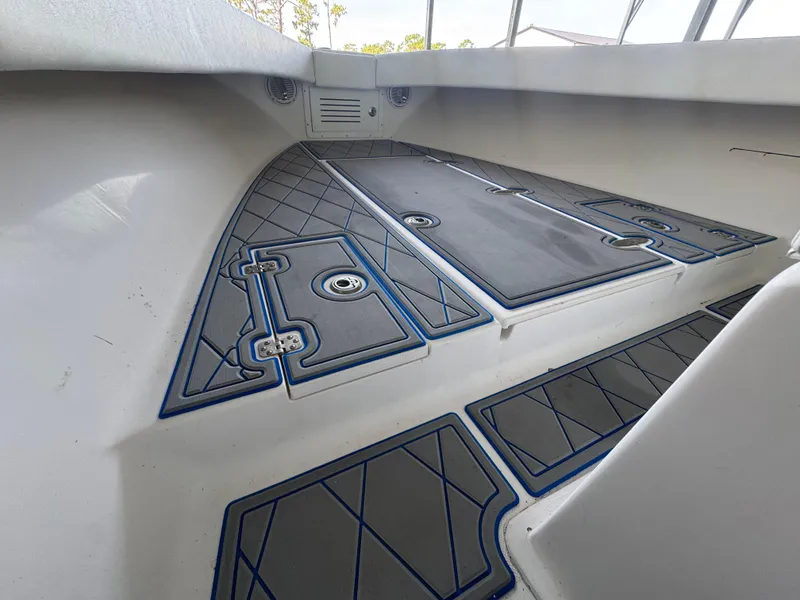 Slide: The Image of Interior view of 2012 Ocean Runner 290i boat with sleek, modern deck design. - 13