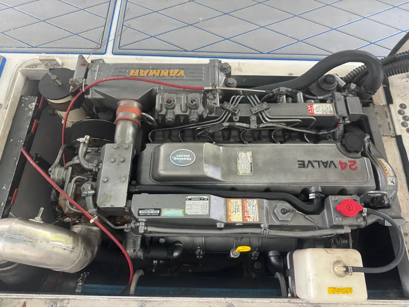 Slide: The Image of Engine of a 2012 Ocean Runner 290i boat, featuring a Yanmar diesel engine. - 15