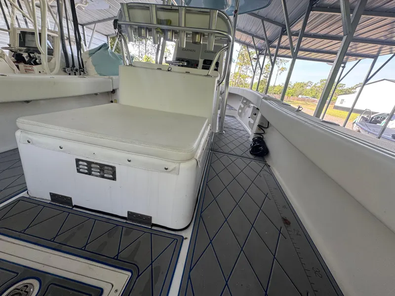 Slide: The Image of Interior of a 2012 Ocean Runner 290i boat with seating and navigation equipment. - 17