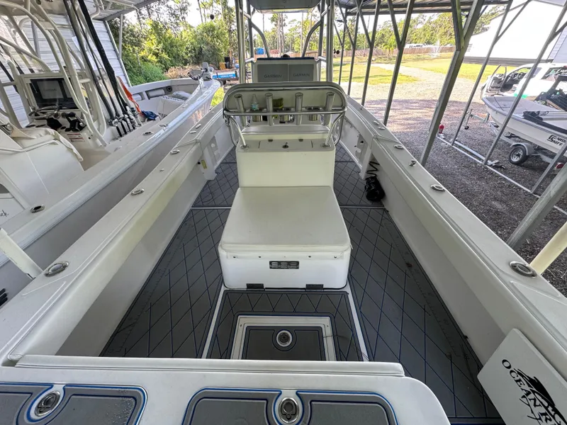 Slide: The Image of 2012 Ocean Runner 290i boat interior with seating and navigation equipment. - 28
