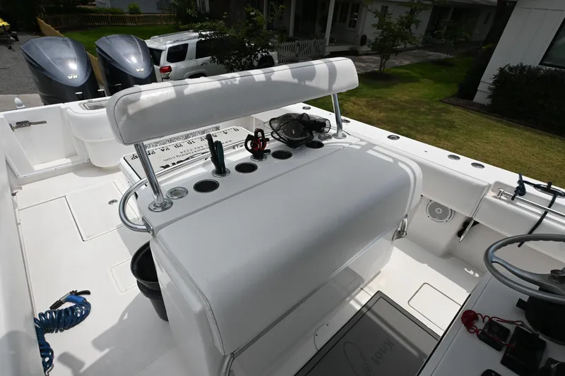 Slide: The Image of 2009 Contender 35 ST boat interior with seating and fishing rod holders. - 14