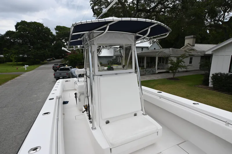 Slide: The Image of 2009 Contender 35 ST boat with T-top parked on residential street. - 17