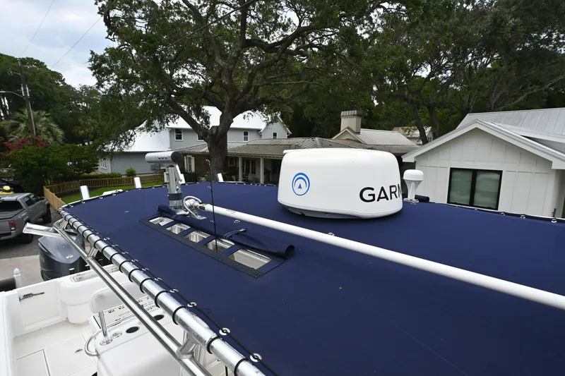 Slide: The Image of 2009 Contender 35 ST boat with Garmin radar, parked near residential homes. - 19