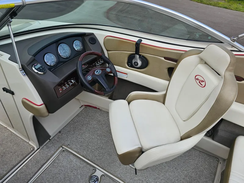 Slide: The Image of Interior of 2007 Sea Ray 210 Select boat with steering wheel and dashboard. - 14