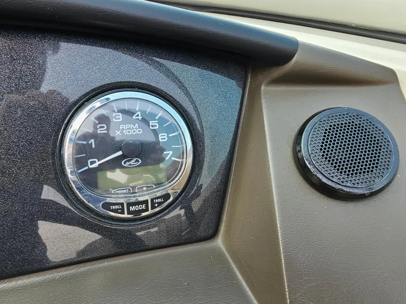 Slide: The Image of Dashboard of 2007 Sea Ray 210 Select with RPM gauge and speaker. - 19