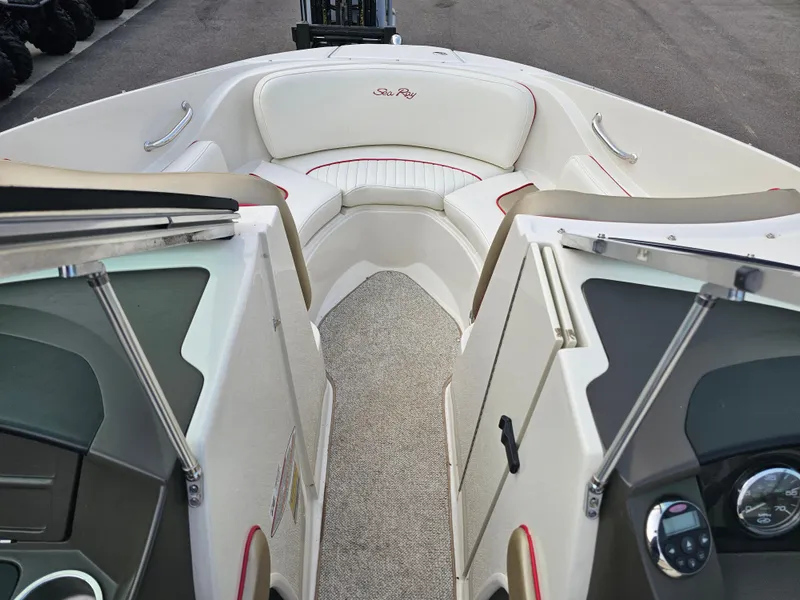 Slide: The Image of 2007 Sea Ray 210 Select boat interior with white seating and red accents. - 22