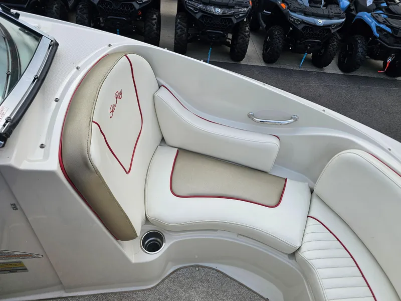 Slide: The Image of 2007 Sea Ray 210 Select boat interior with white and beige seating. - 24