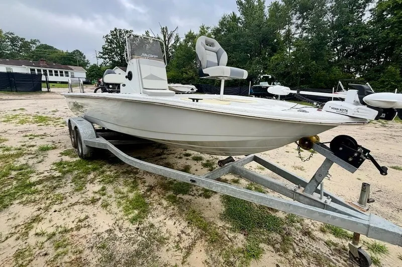 Slide: The Image of 2019 Key Largo 206 Bay boat on trailer, parked outdoors. - 2
