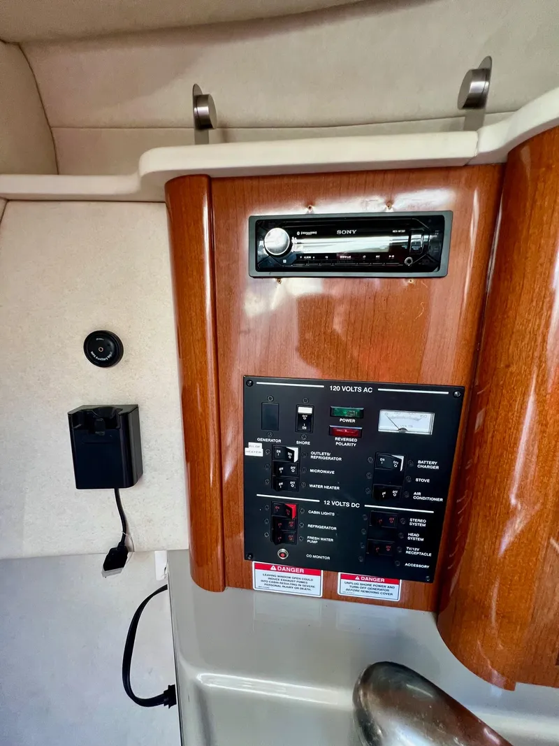 Slide: The Image of Control panel of a 2009 Sea Ray 240 Sundancer boat with audio system. - 14