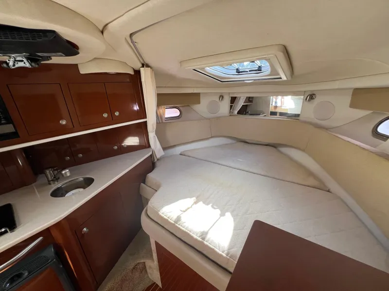 Slide: The Image of 2008 Sea Ray 290 Amberjack electrical panel with stereo and control switches. - 12