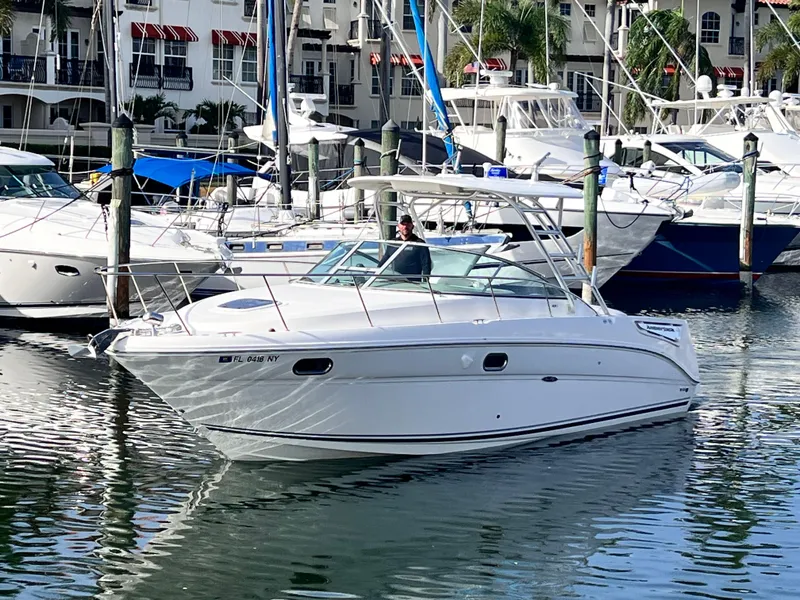 Slide: The Image of 2008 Sea Ray 290 Amberjack boat with "My Way" nameplate, docked on clear water. - 2