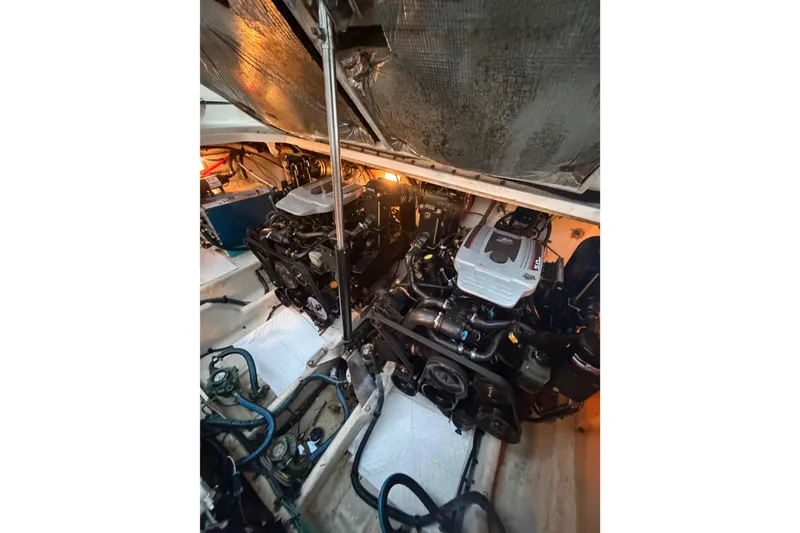 Slide: The Image of Engine compartment of 2008 Sea Ray 290 Amberjack with dual engines visible. - 25