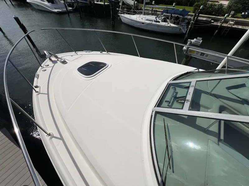 Slide: The Image of 2008 Sea Ray 290 Amberjack helm with gauges, steering wheel, and navigation equipment. - 3