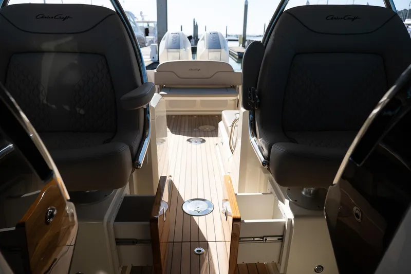 Slide: The Image of 2024 Chris-Craft Calypso 32 interior with luxurious seating and sleek design. - 26
