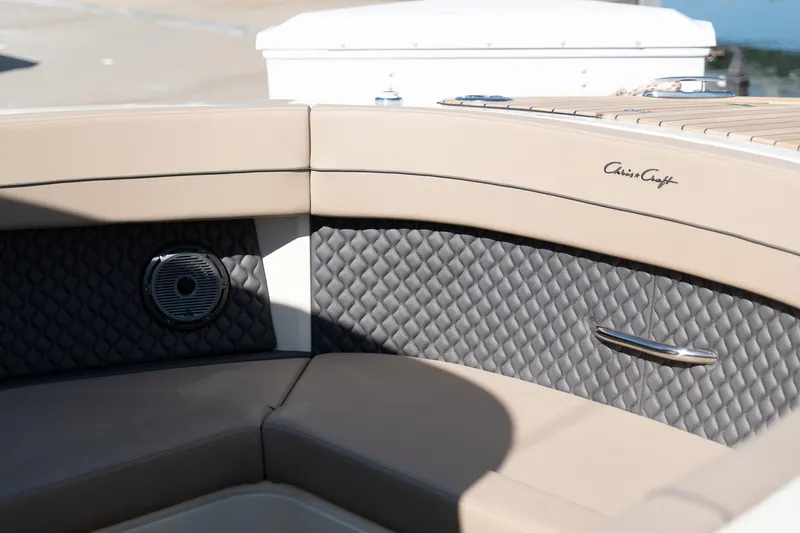Slide: The Image of 2024 Chris-Craft Calypso 32 interior with quilted upholstery and speaker detail. - 31