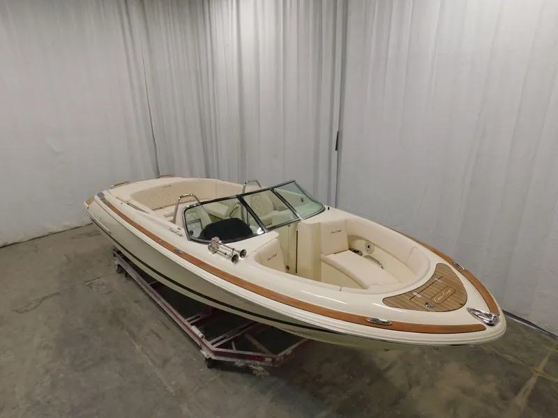 Slide: The Image of 2023 Chris-Craft Launch 27 boat in showroom. - 6