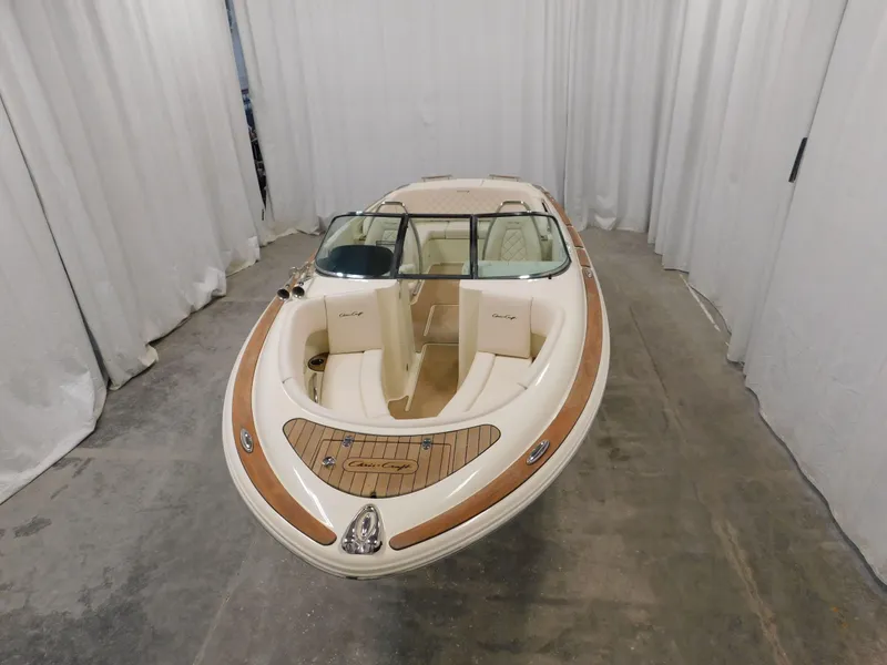 Slide: The Image of 2023 Chris-Craft Launch 27 boat in showroom. - 8