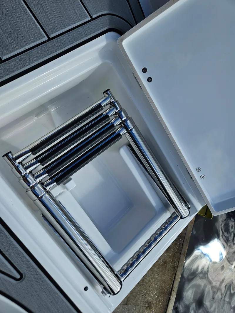 Slide: The Image of Stainless steel ladder in Monterey M-205 boat compartment, 2026 model. - 12