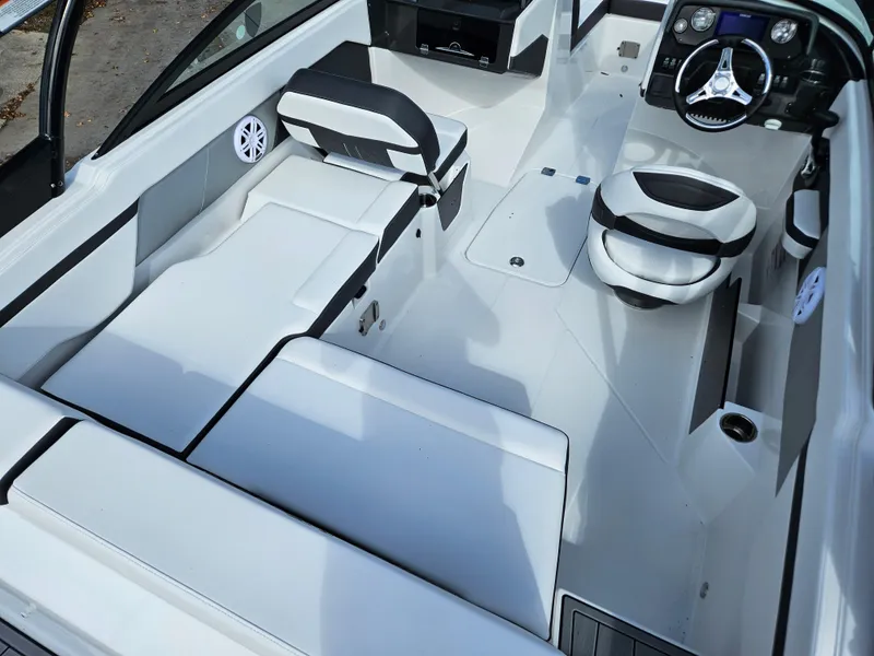 Slide: The Image of Interior of 2026 Monterey M-205 boat with sleek seating and modern dashboard. - 13