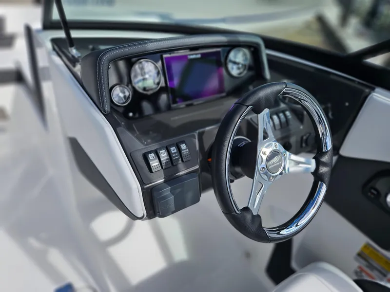Slide: The Image of 2026 Monterey M-205 boat dashboard with steering wheel and digital display. - 16