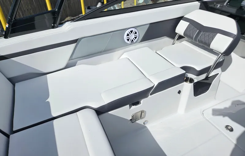 Slide: The Image of 2026 Monterey M-205 boat interior with white seating and speaker detail. - 21