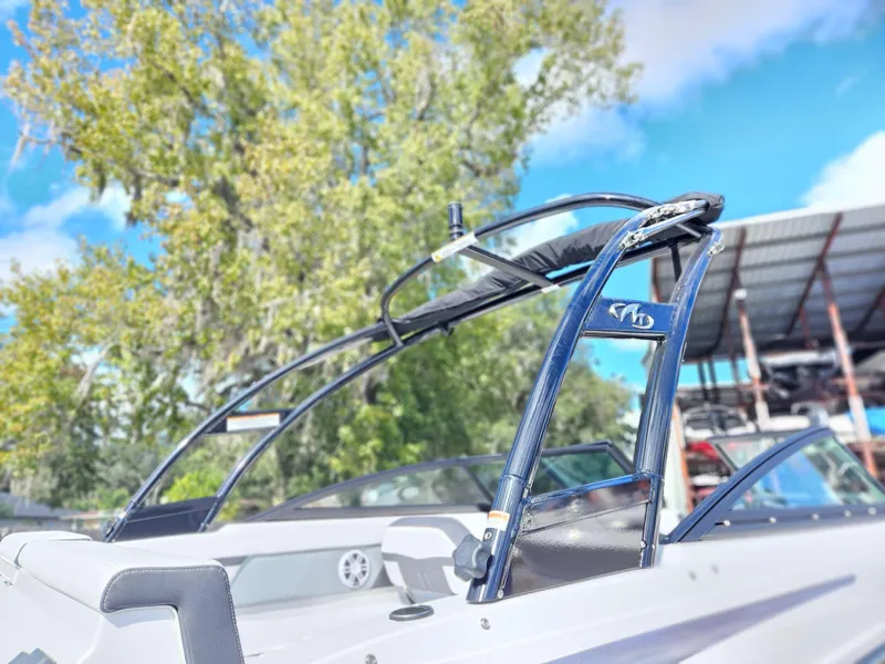 Slide: The Image of 2026 Monterey M-205 boat with sleek design, docked under clear blue sky. - 3