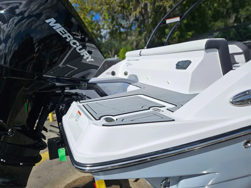 Slide: The Image of 2026 Monterey M-205 boat with Mercury engine, rear view in sunlight. - 4