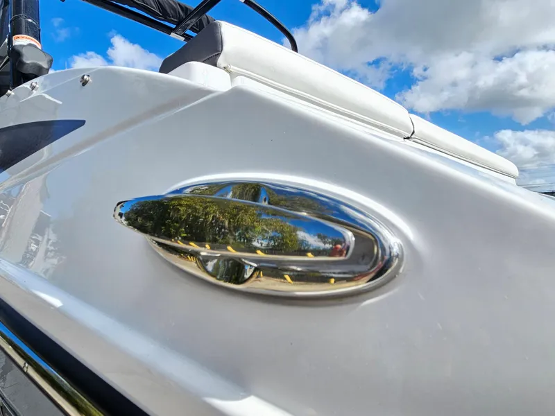 Slide: The Image of 2026 Monterey M-205 boat detail with chrome accent against blue sky and clouds. - 6