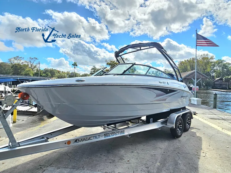 Slide: The Image of 2026 Monterey M-205 boat on trailer at North Florida Yacht Sales, under a partly cloudy sky. - 1