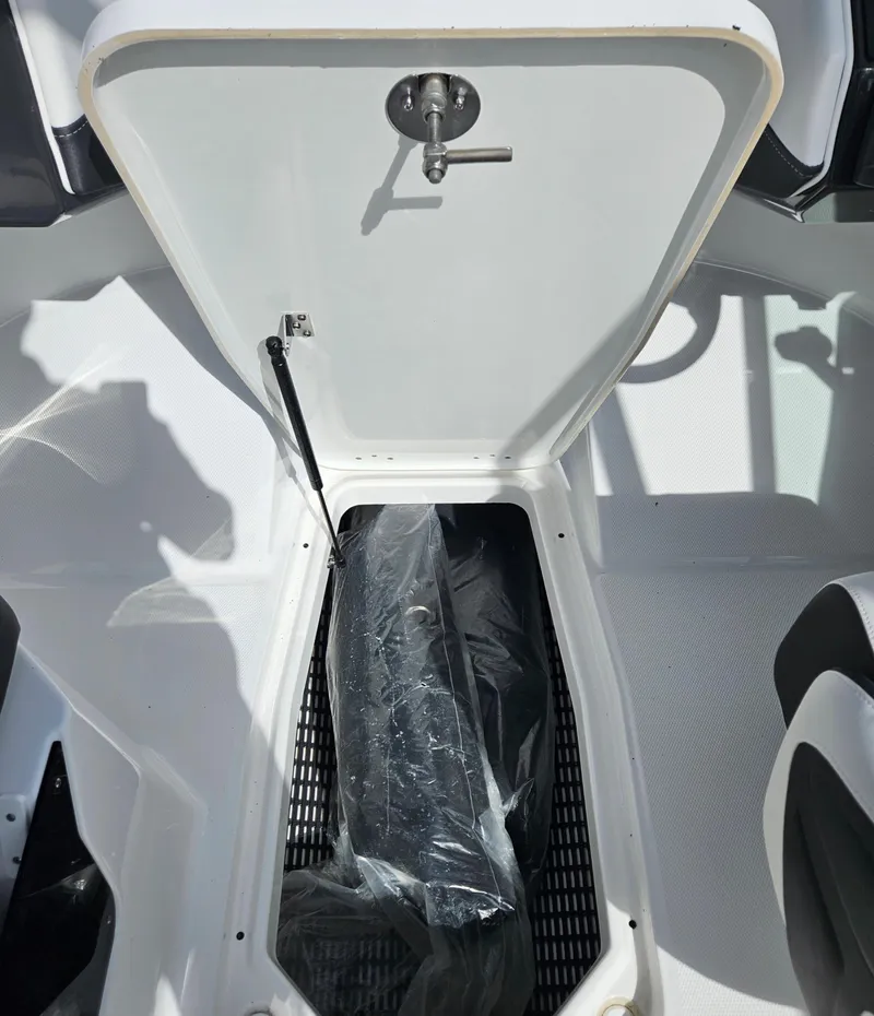 Slide: The Image of 2026 Monterey M-205 boat storage compartment with open hatch and visible interior. - 20