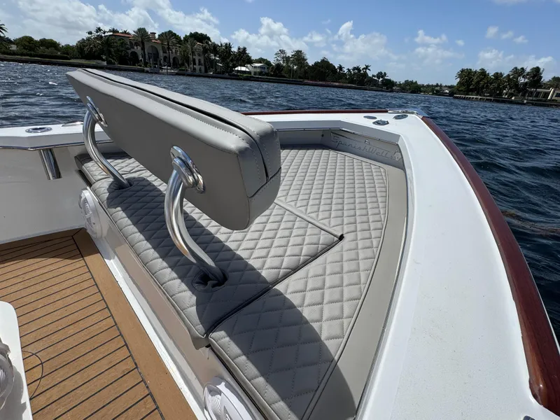 Slide: The Image of Luxury seating on 2024 Dragonfly 21 Spanish Wells boat, featuring quilted upholstery and scenic water view. - 22