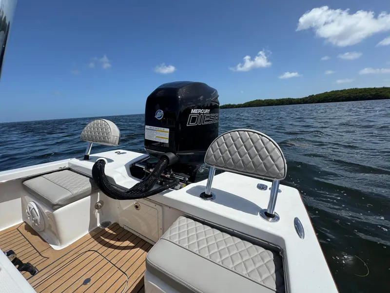 Slide: The Image of 2024 Dragonfly 21 Spanish Wells boat with Mercury Diesel engine on open water. - 25