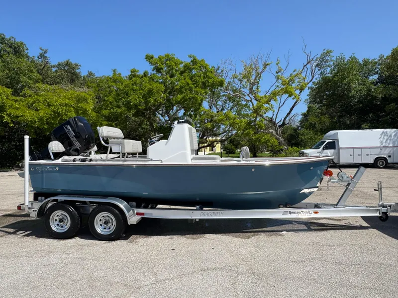 Slide: The Image of 2024 Dragonfly 21 Spanish Wells boat on trailer, parked outdoors. - 8