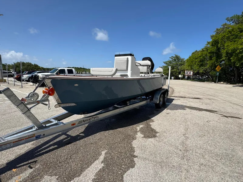 Slide: The Image of 2024 Dragonfly 21 Spanish Wells boat on trailer in sunny parking lot. - 9