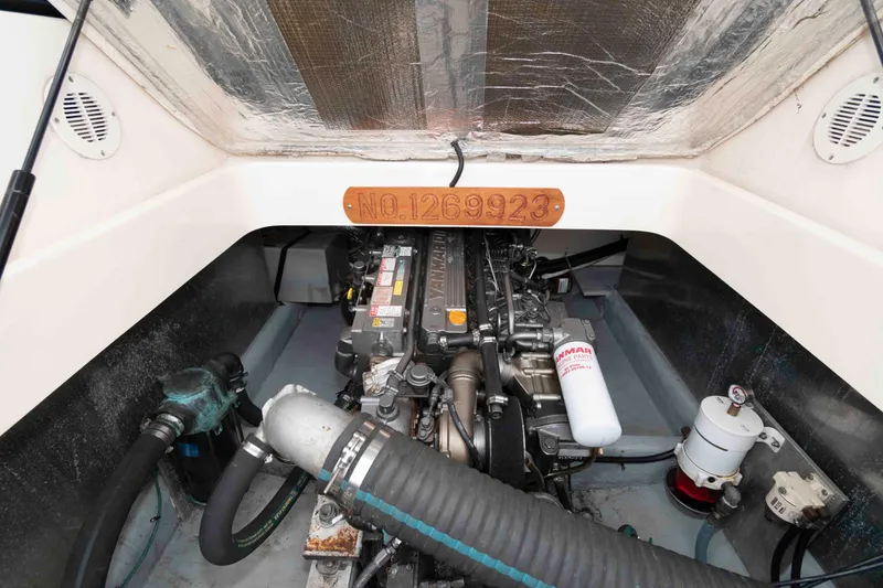 Slide: The Image of Engine compartment of 2004 Mainship 34 Pilot Rum Runner II, showcasing detailed components. - 15