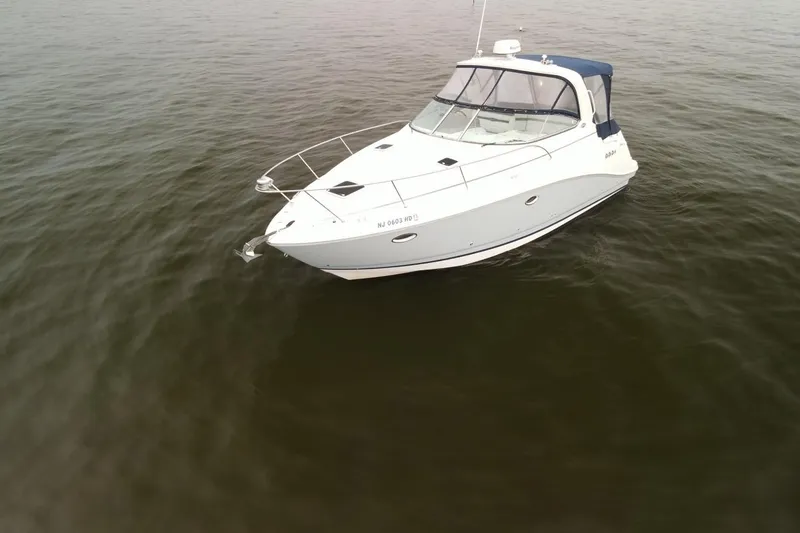 Slide: The Image of 2009 Rinker 340 Express Cruiser on calm water, aerial view. - 3