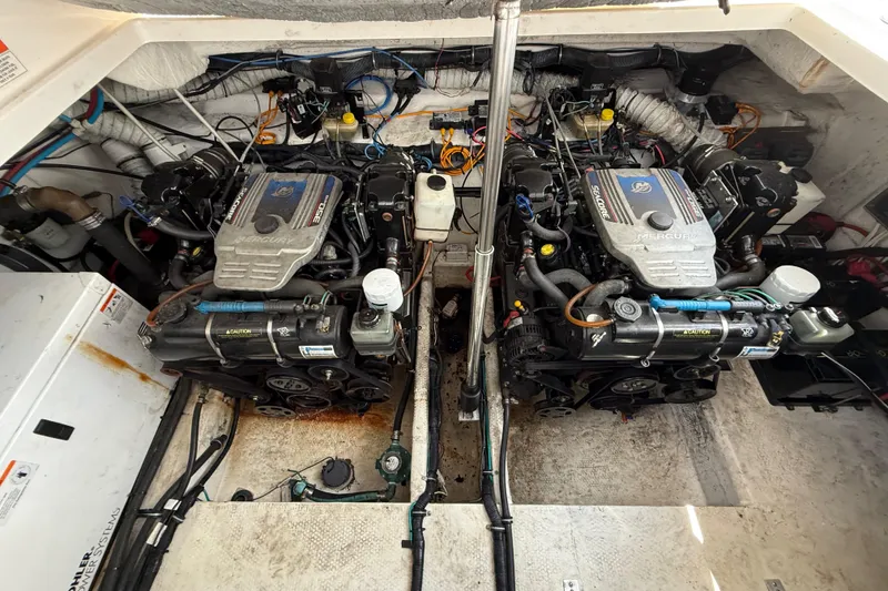 Slide: The Image of Engine compartment of a 2009 Rinker 340 Express Cruiser with dual Mercury engines. - 37