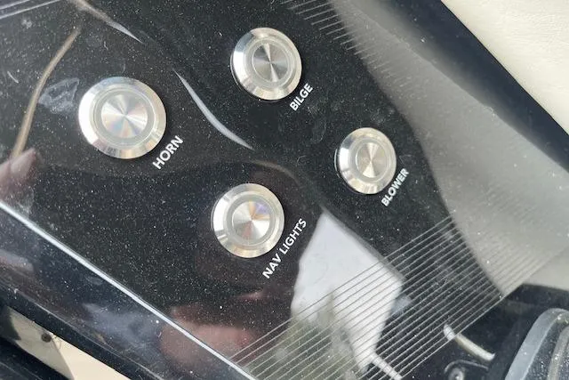 Slide: The Image of Control panel of 2021 Yamaha Boats 275 SE with horn, bilge, nav lights, blower buttons. - 16