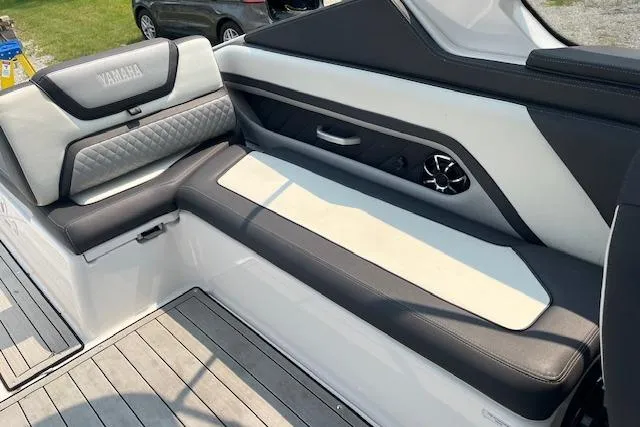 Slide: The Image of 2021 Yamaha Boats 275 SE interior with sleek seating and modern design. - 21