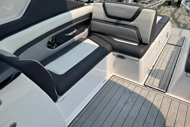 Slide: The Image of 2021 Yamaha Boats 275 SE interior with sleek seating and modern design. - 22