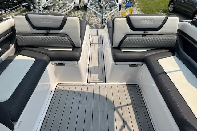 Slide: The Image of Interior view of 2021 Yamaha Boats 275 SE with luxurious seating and sleek design. - 23