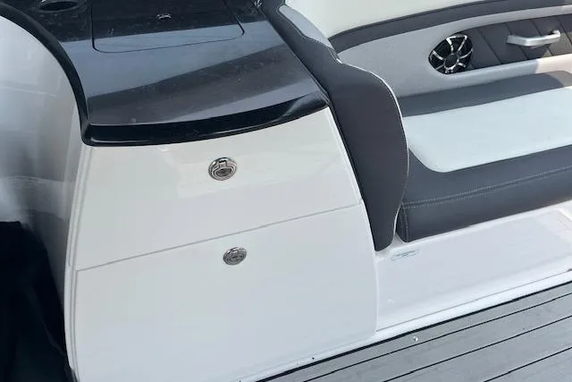 Slide: The Image of 2021 Yamaha Boats 275 SE interior with sleek seating and modern design elements. - 24