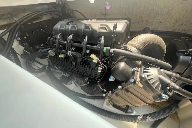 Slide: The Image of Engine compartment of 2021 Yamaha Boats 275 SE, showcasing intricate mechanical components. - 32