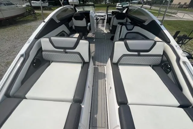 Slide: The Image of 2021 Yamaha Boats 275 SE interior with sleek seating and modern design. - 33