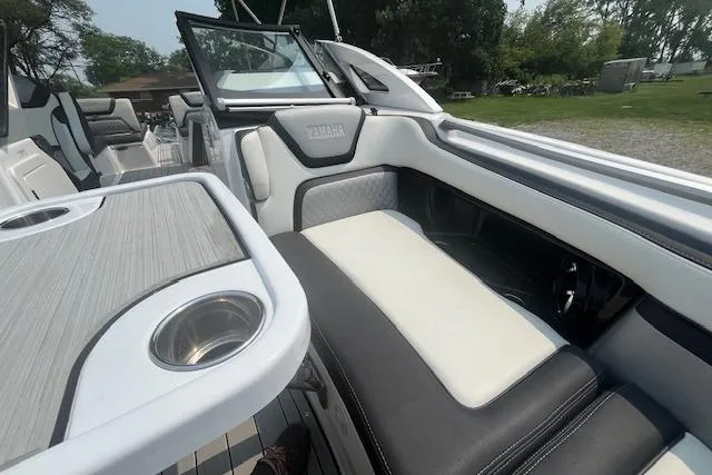 Slide: The Image of 2021 Yamaha Boats 275 SE interior with sleek seating and modern design. - 39
